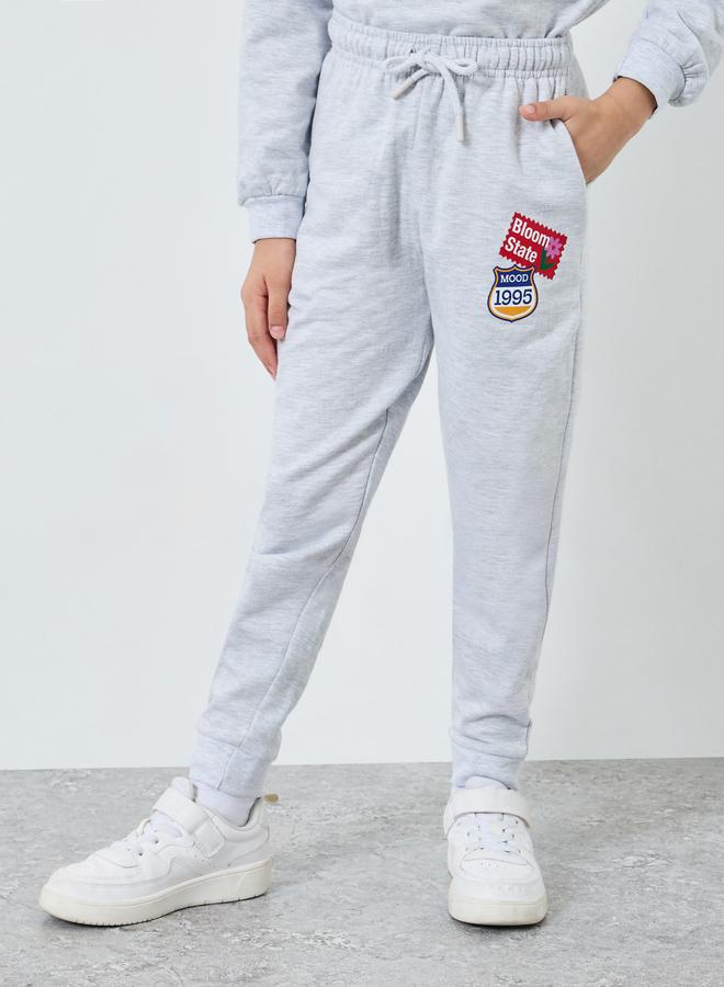 ستايلي جوغر بحواف مكبلة وطبعة جرافيك - Image 1